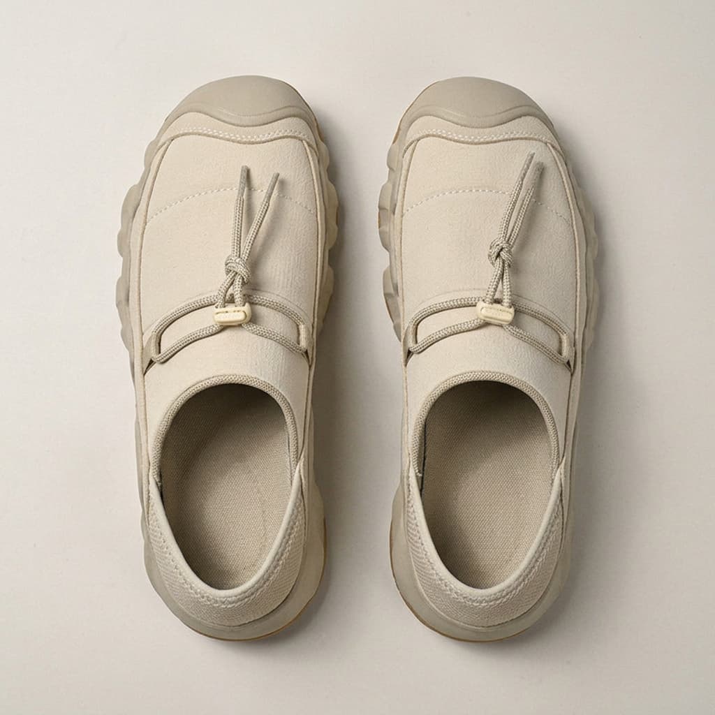 Amos Canvas Sneakers — premium cushioned slip-on with bungee toggle and lugged sole