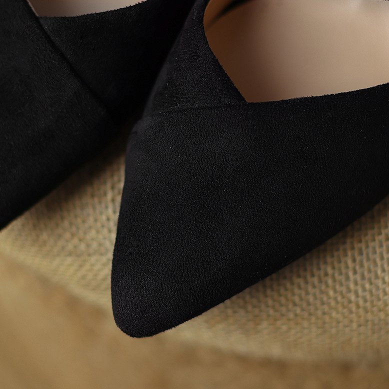 Thea Knotted Mules in Black — pointed toe and knotted strap detail