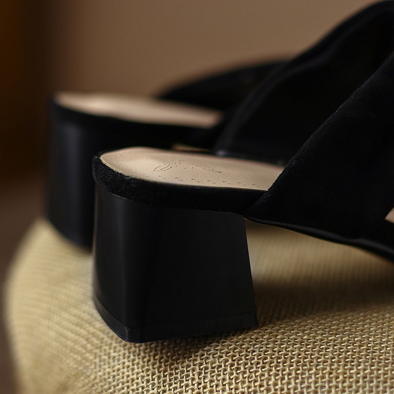 Thea Knotted Mules in Black — flared block heel detail