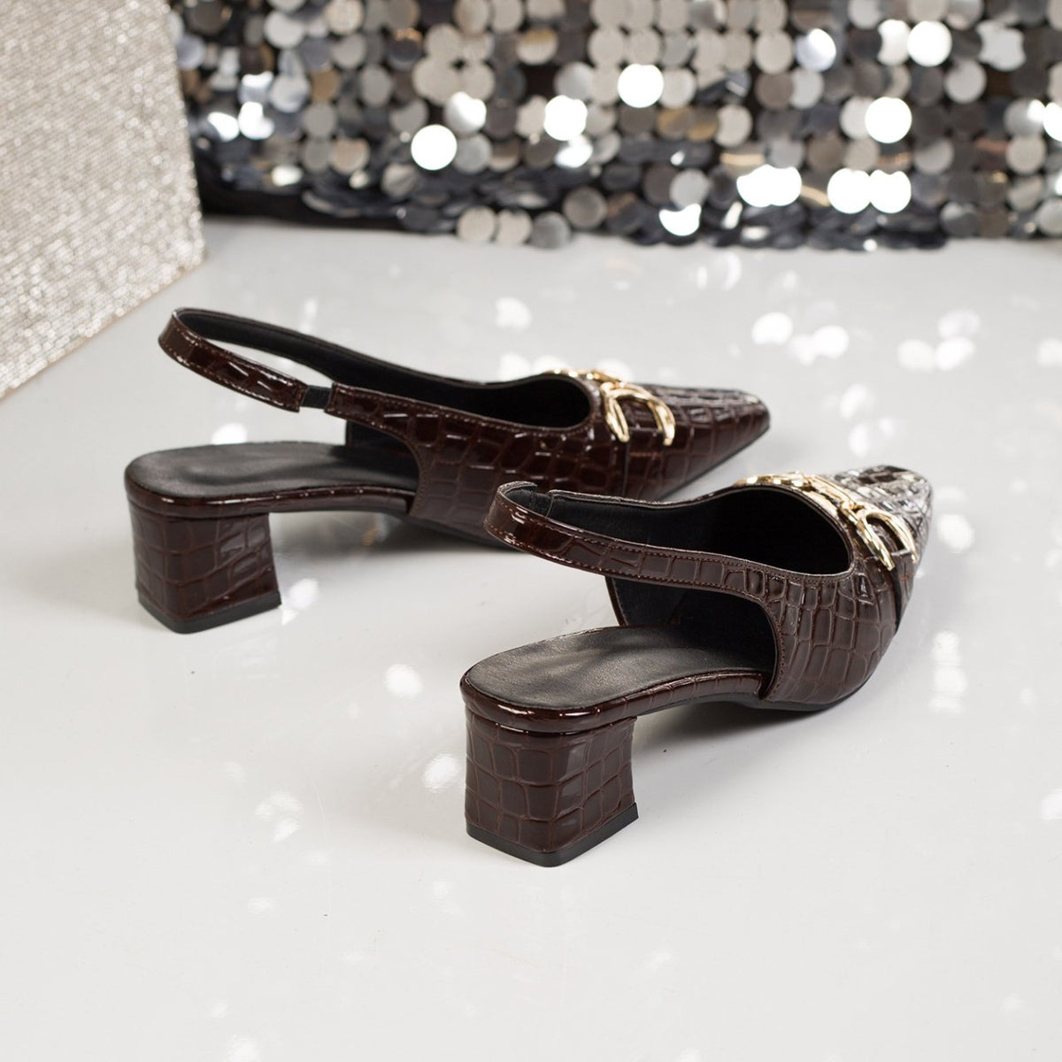 Sophie Croc Slingbacks in Dark Brown — close-up of the block heel and open slingback back