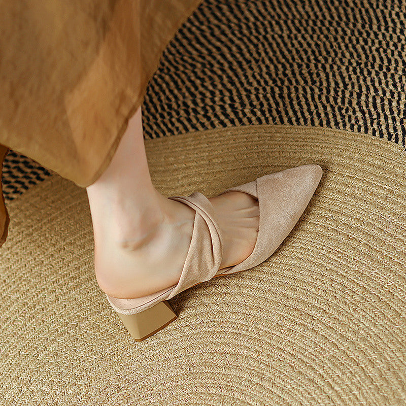 Thea Knotted Mules in Beige — worn with wide-leg trousers