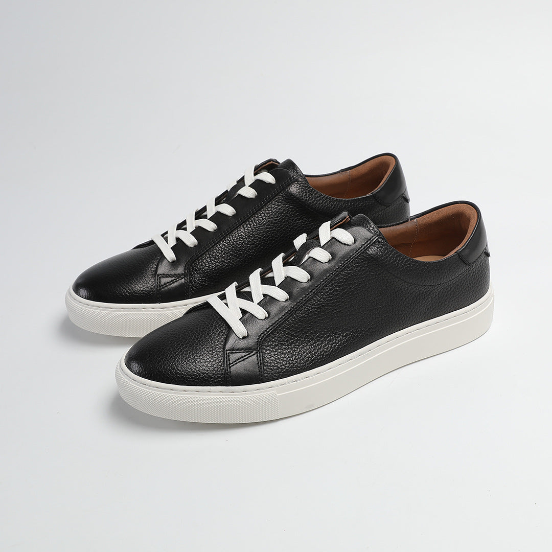 Carter Court Sneakers in Black — three-quarter view of the pebbled leather pair