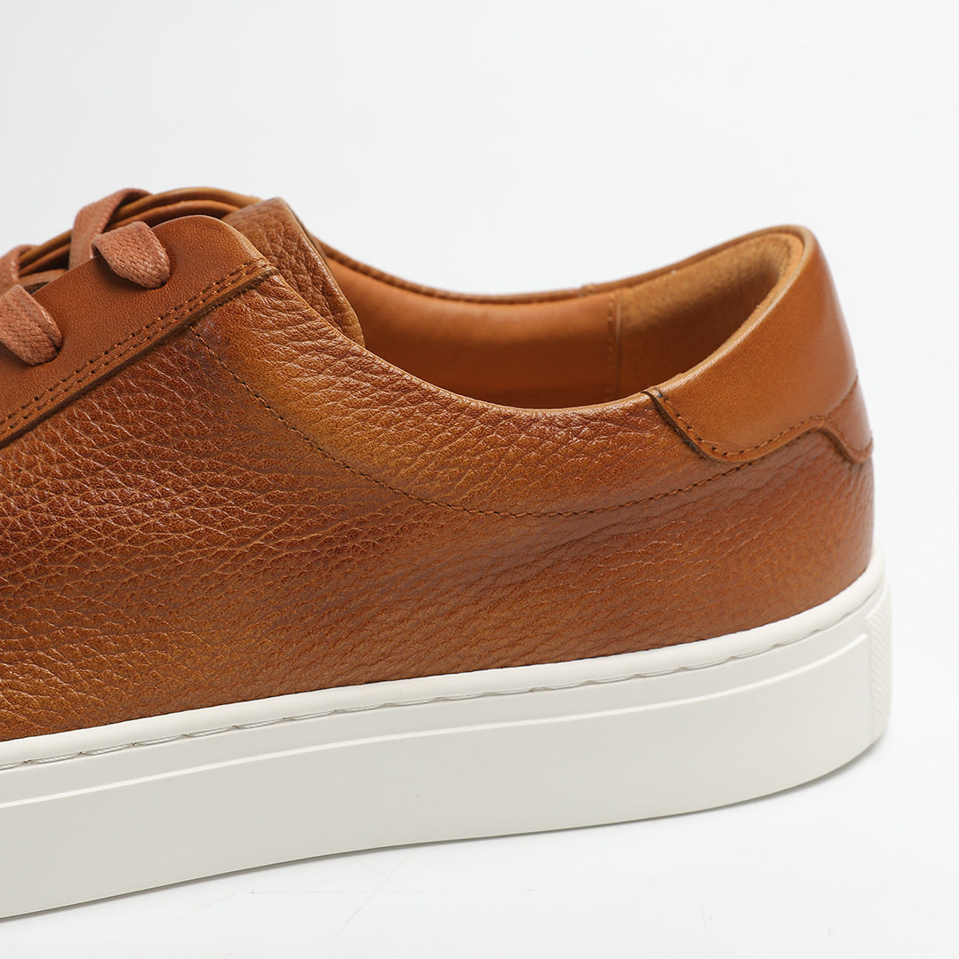 Carter Court Sneakers in Light Brown — close-up of the leather upper and white sole edge