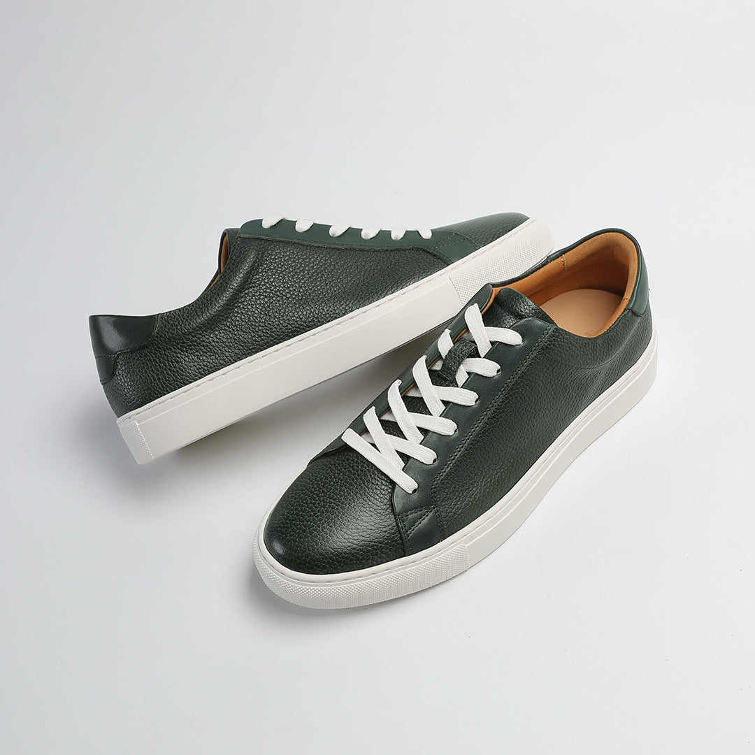 Carter Court Sneakers in Dark Green — angled pair on a white cupsole