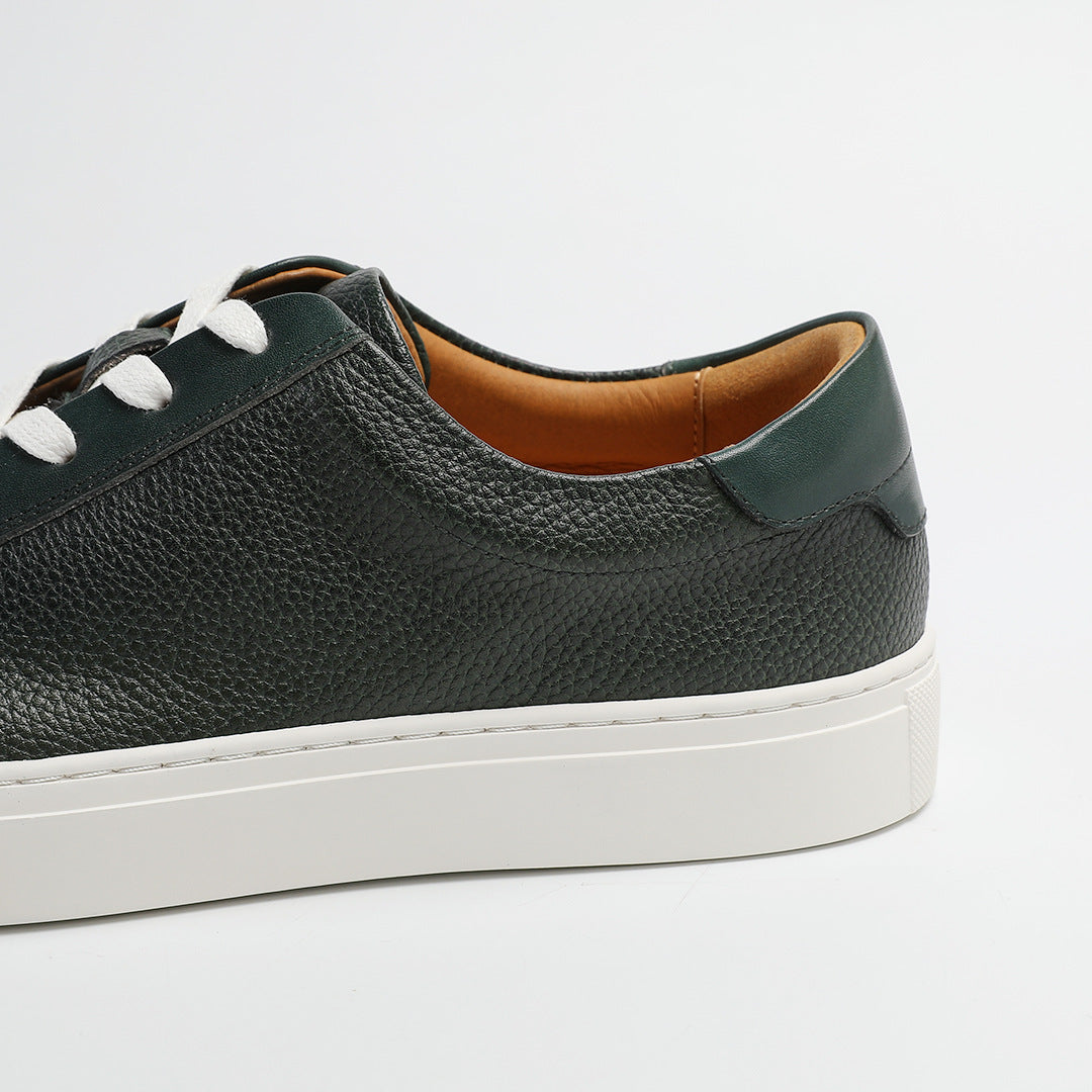 Carter Court Sneakers in Dark Green — close-up of the leather upper and white sole edge