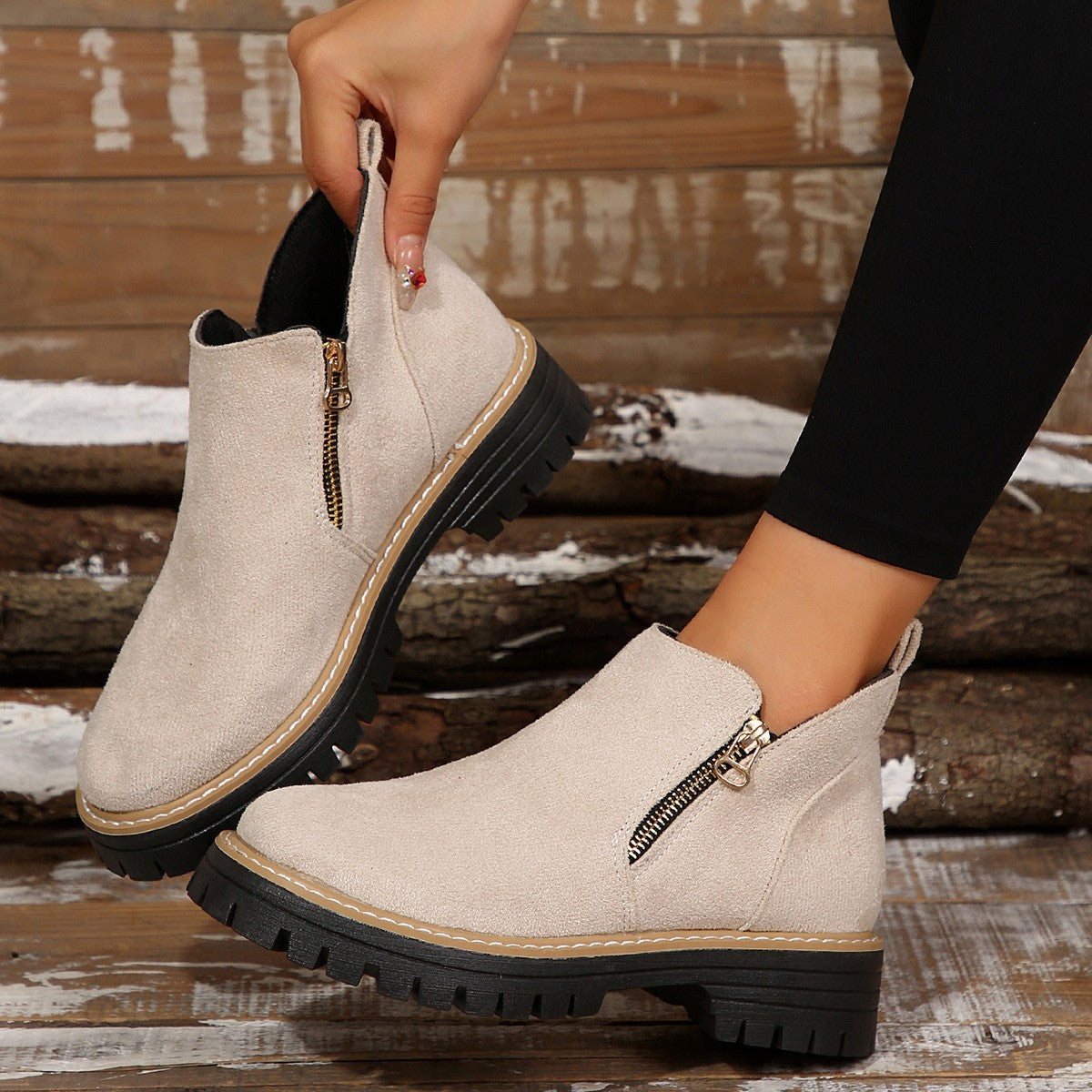 Sage Chunky Boots in Beige — worn pair showing the pull tab and treaded sole