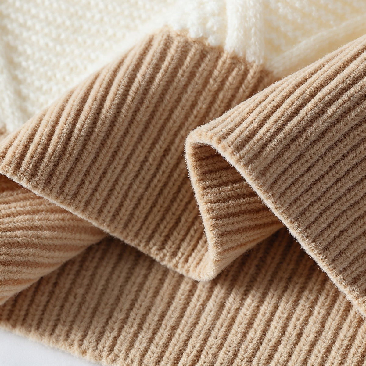Sawyer Cable-Knit Sweater in Blue — closeup of colorblock panels