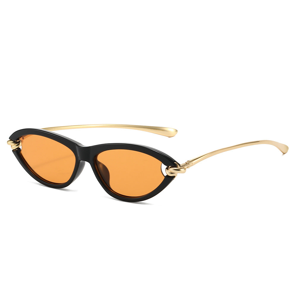 Paloma Sunglasses in Orange — glossy cat-eye sunglasses with gold-knot temples