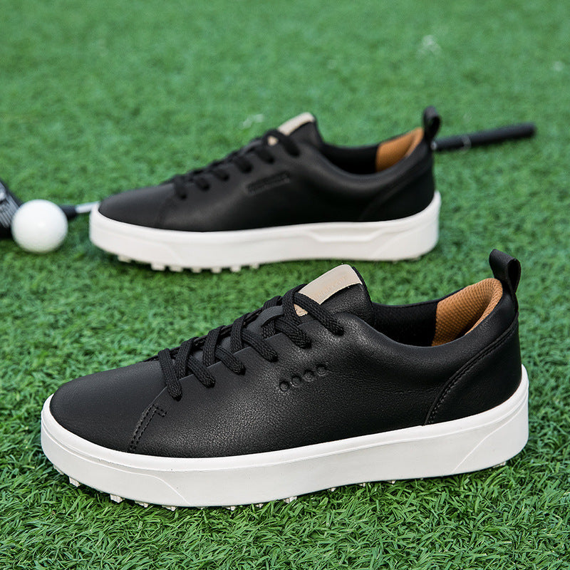 Conrad Golf Shoes in Black — smooth leather golf sneakers with grip sole pair view