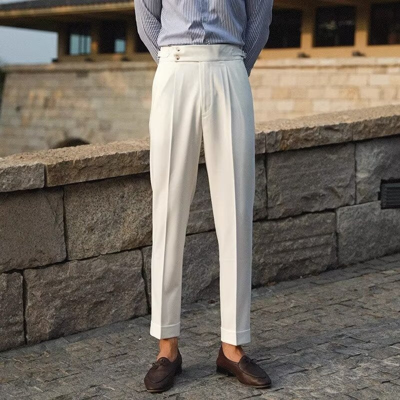 Matteo Pleated Trousers in White — high-rise dress trousers with double pleats and side tabs