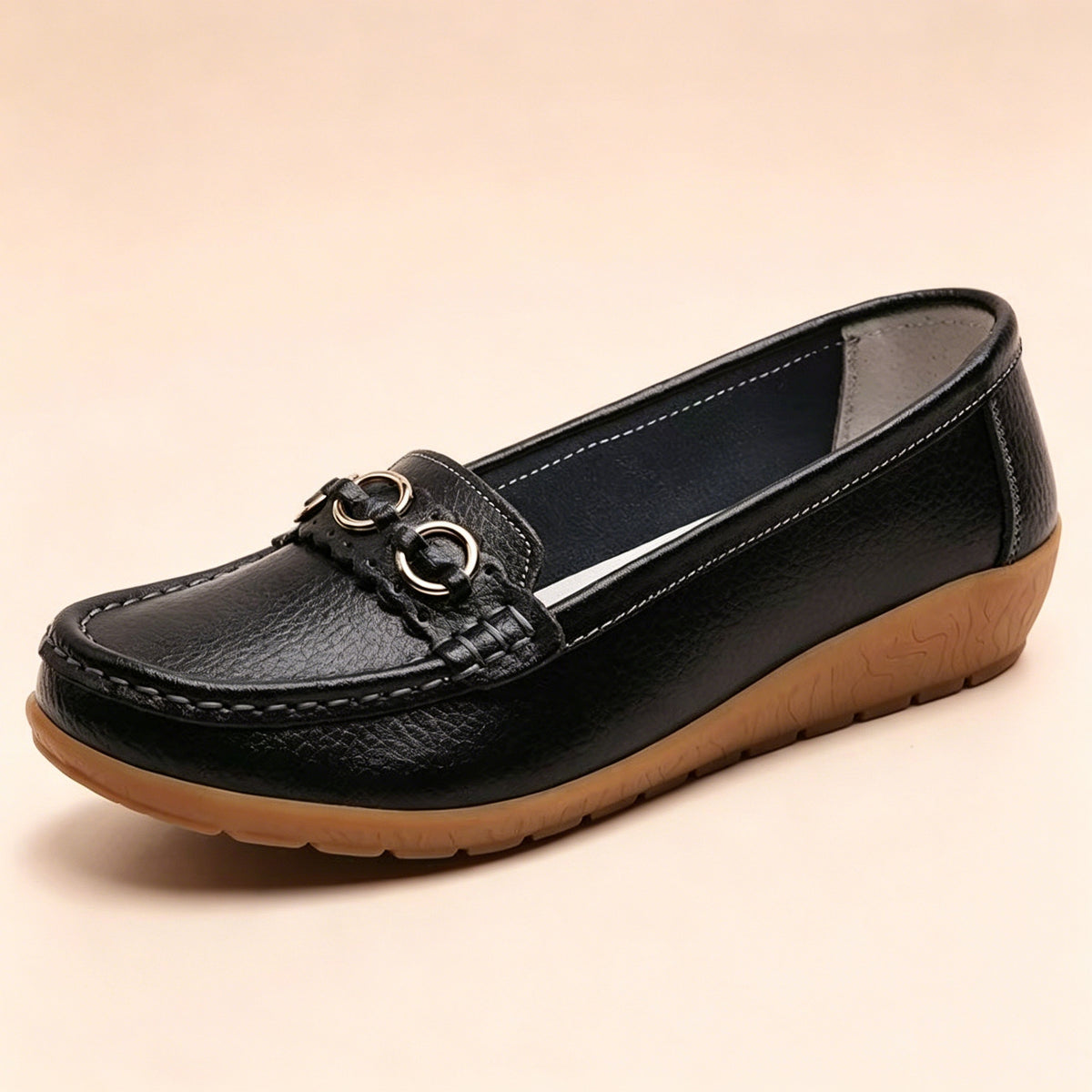 Nella Wedge Loafers in Black — side view of the leather upper and low wedge sole
