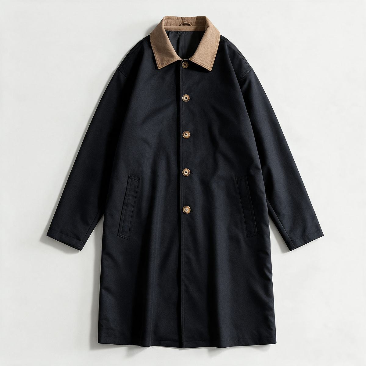 Sutton Trench Coat — longline cotton twill coat with a contrast corduroy collar and horn-tone button front