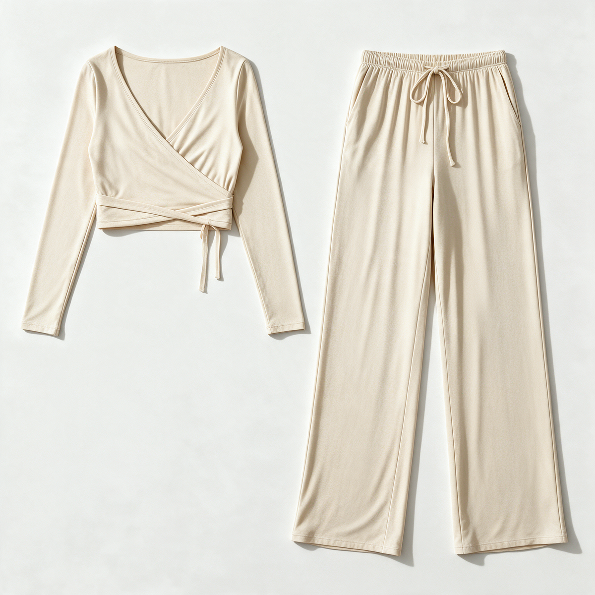 Julia Active Set in Cream — flat lay of the cropped wrap top and matching wide-leg drawstring pants