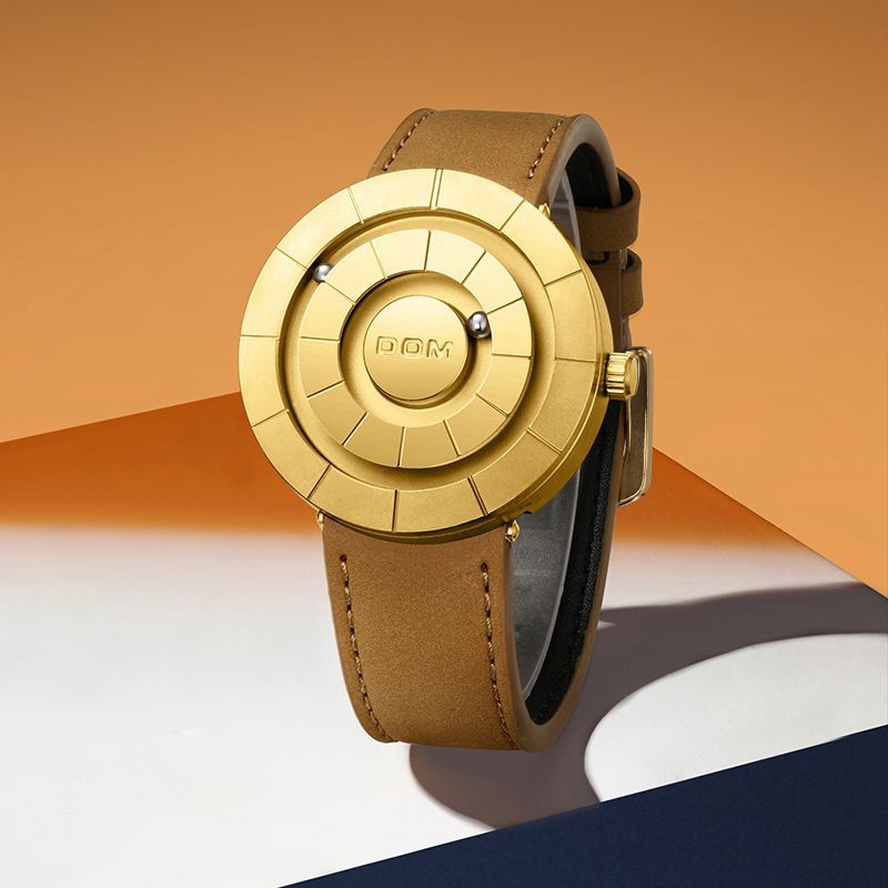 Dom Orbit Watch in Gold — angled view showing the domed dial and stitched leather strap