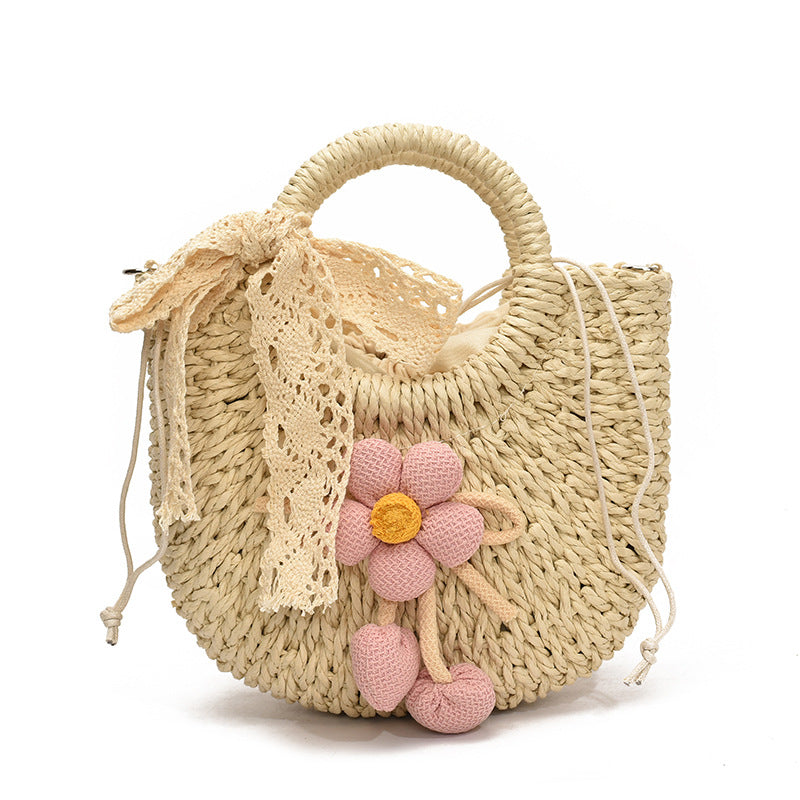 Noemi Straw Bag in Pink — woven straw handbag with lace bow