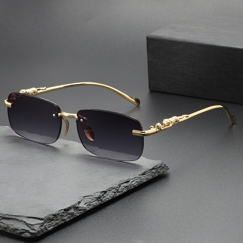 Dante Sunglasses in Gray — rimless frame with gold leopard temples