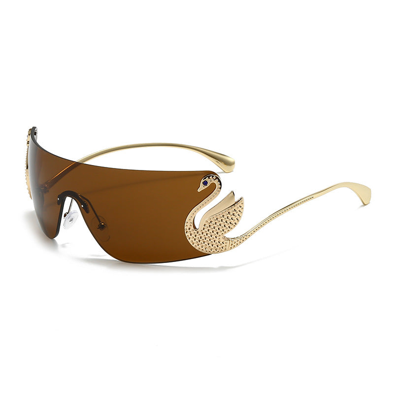Bianca Sunglasses in Brown (detail) — gold-tone wraparound with sculpted swan accent