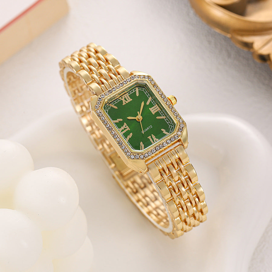 Seraphine Crystal Watch in Green — gold-tone bracelet watch with crystal-lined bezel and Roman numerals