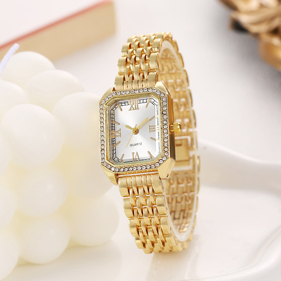 Seraphine Crystal Watch in White — gold-tone bracelet watch with crystal-lined bezel and Roman numerals