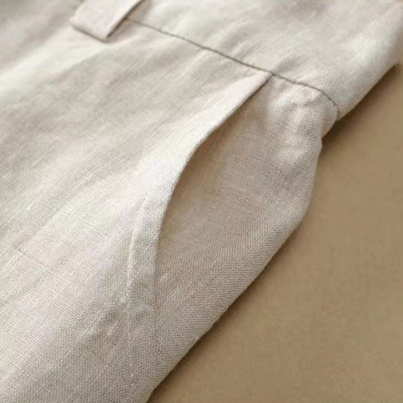 Amara Linen Trousers in Beige — fabric detail