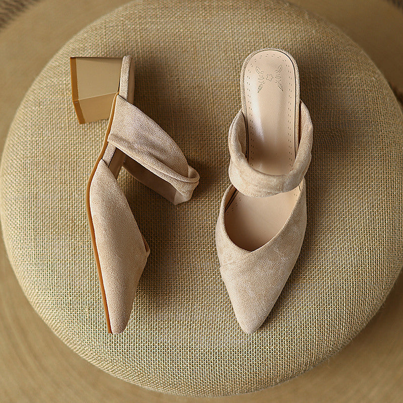 Thea Knotted Mules in Beige — angled view with block heel