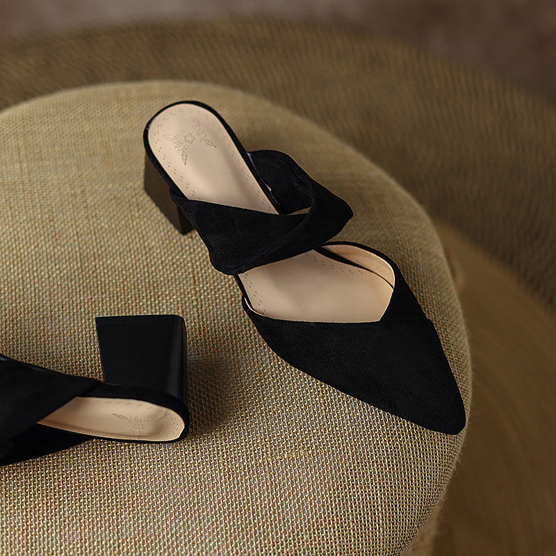 Thea Knotted Mules in Black — angled view with block heel