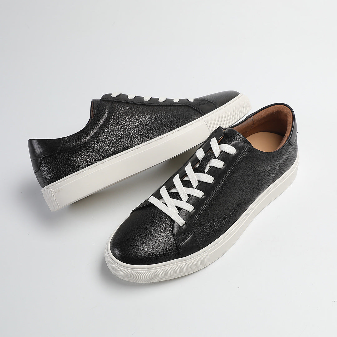 Carter Court Sneakers in Black — angled pair on a white cupsole