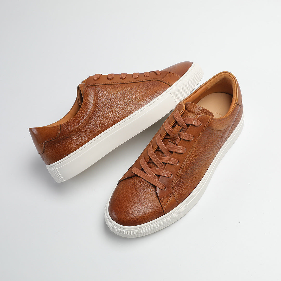 Carter Court Sneakers in Light Brown — angled pair on a white cupsole
