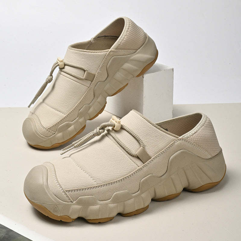 Amos Canvas Sneakers in Beige — premium cushioned slip-on with bungee toggle and lugged sole
