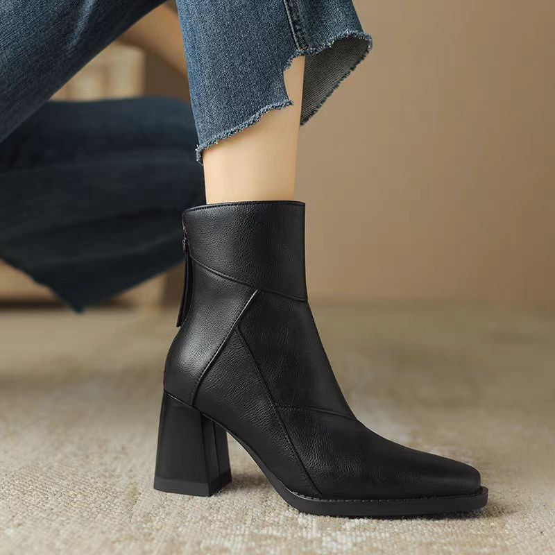 Noemie Square Boots in Black — worn close-up showing the folded cuff and stacked heel