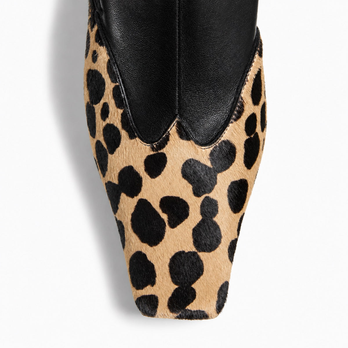 Amelia Pointed Boots in Leopard — close-up of the leopard-print contrast toe cap