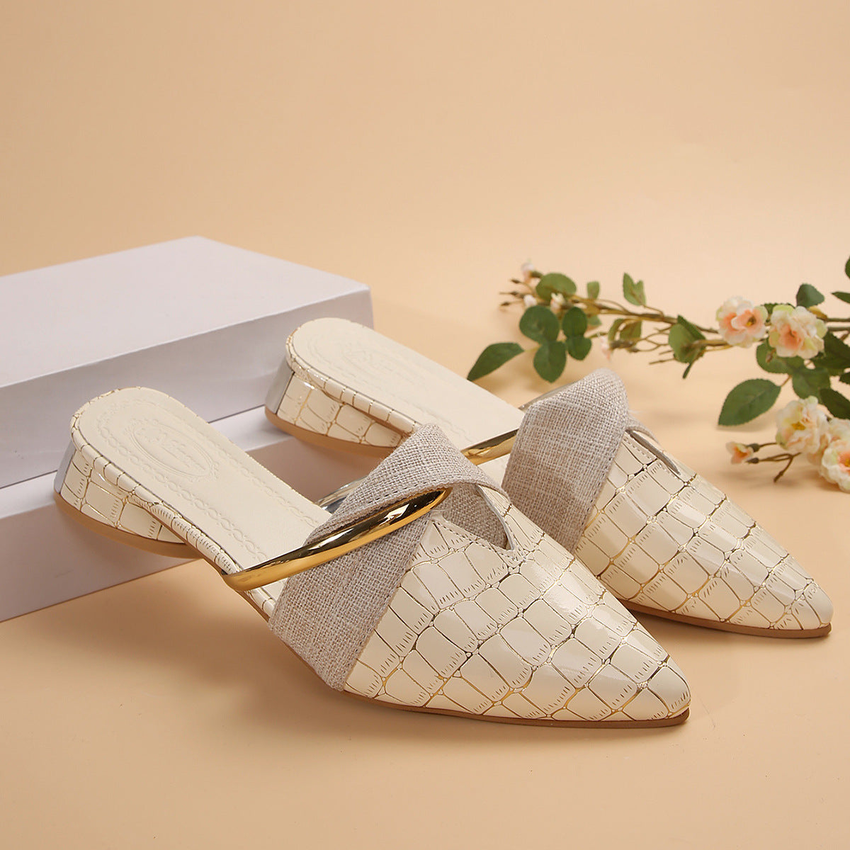 Giselle Mule Flats in Beige — glossy croc-embossed leather pointed-toe mules