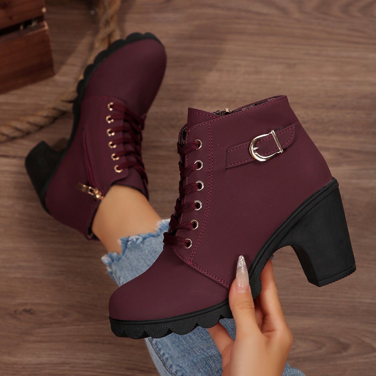 Cara Platform Boots in Burgundy — close-up of the gold buckle strap and eyelets