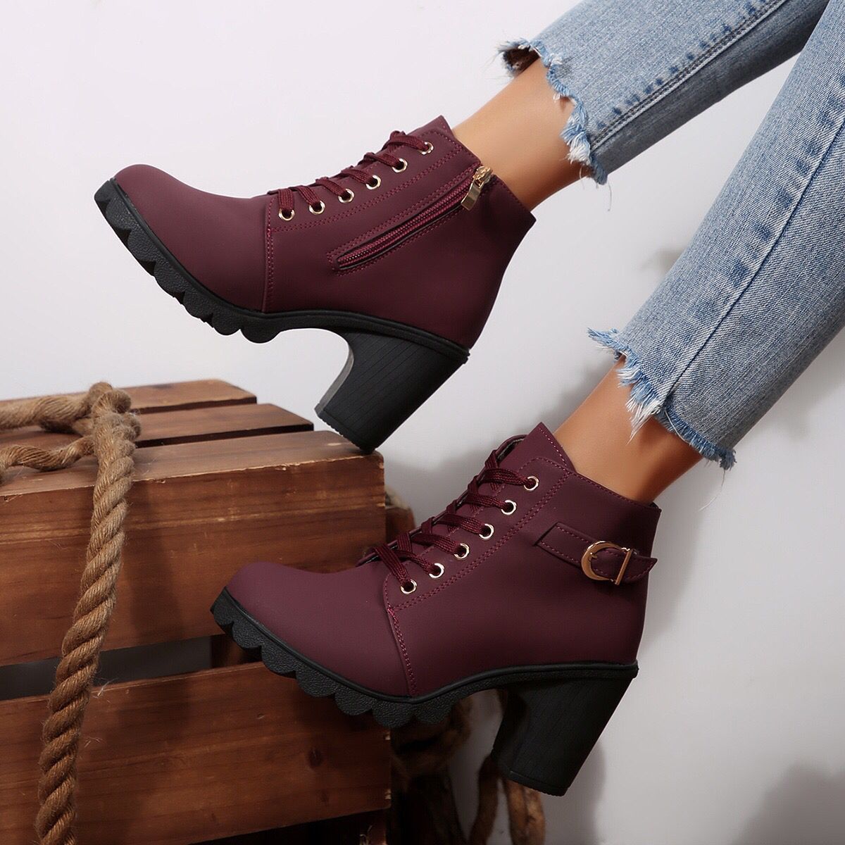 Cara Platform Boots in Burgundy — worn with jeans, showing the lace-up front