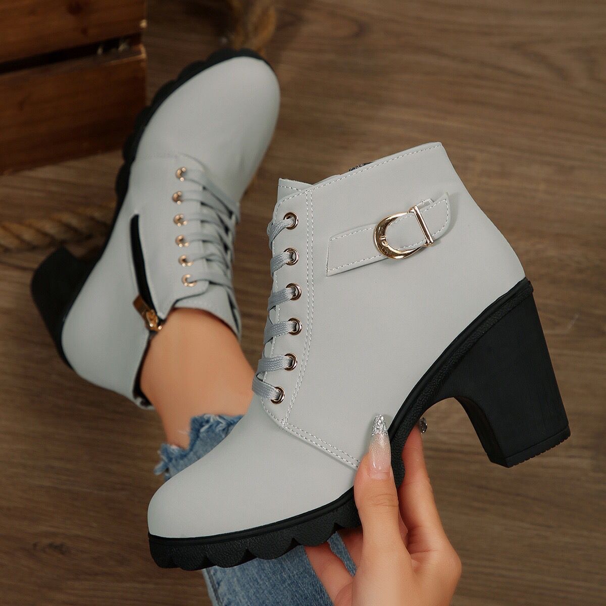 Cara Platform Boots in Light Gray — close-up of the gold buckle strap and eyelets