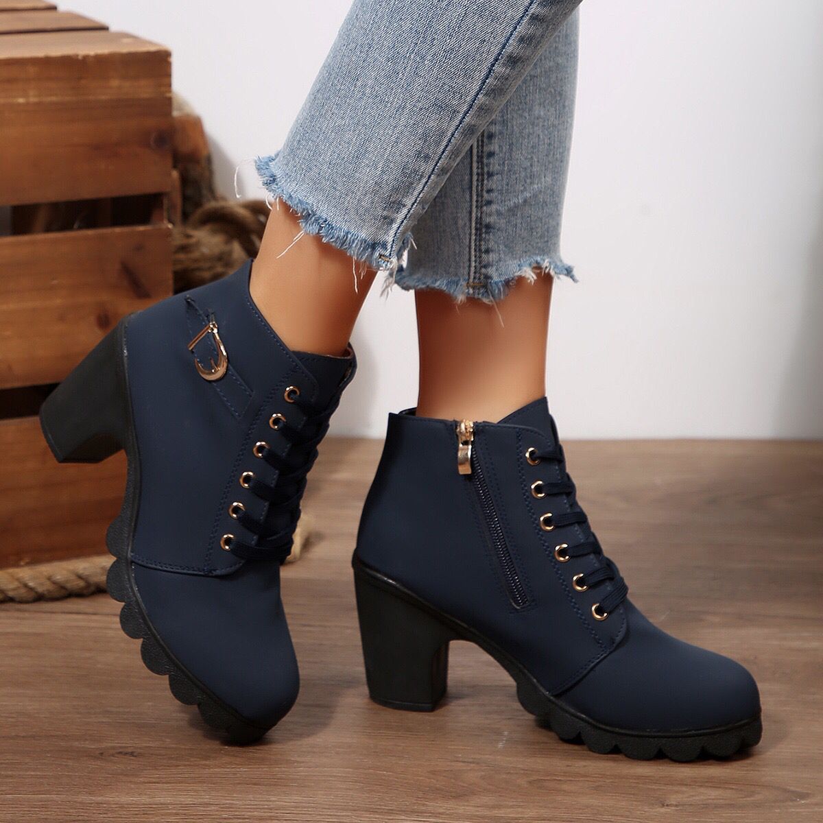 Cara Platform Boots in Navy Blue — worn with jeans, showing the lace-up front