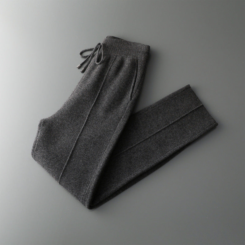 Margot Cashmere Trousers in Dark Gray — folded knit trousers showing front crease