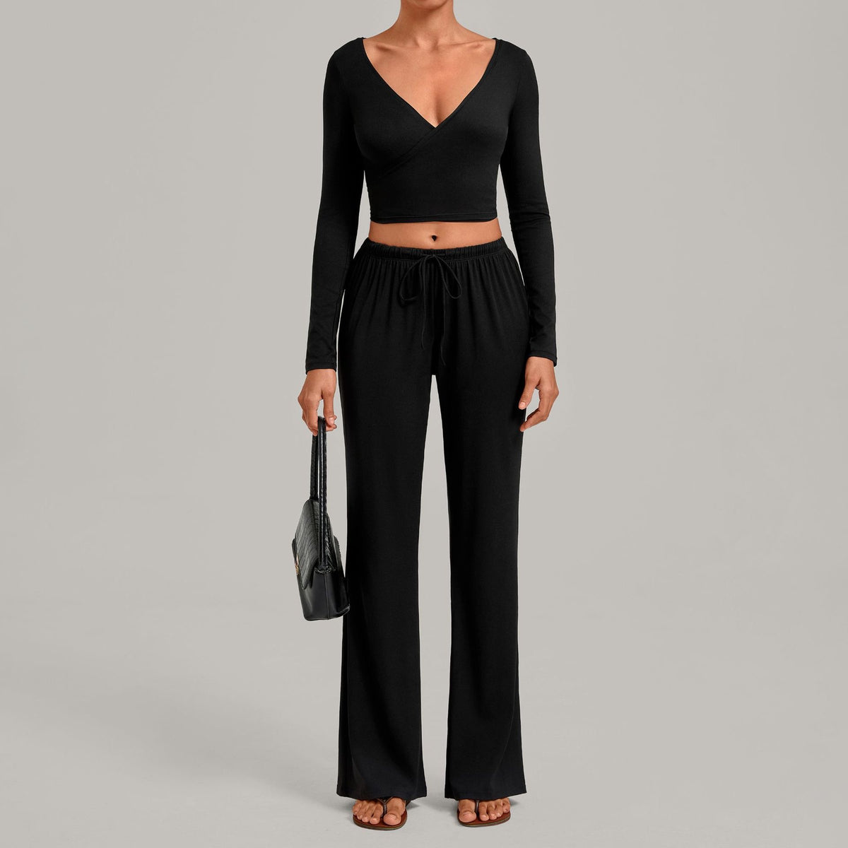 Julia Active Set in Black — cropped long-sleeve wrap top with matching wide-leg drawstring pants