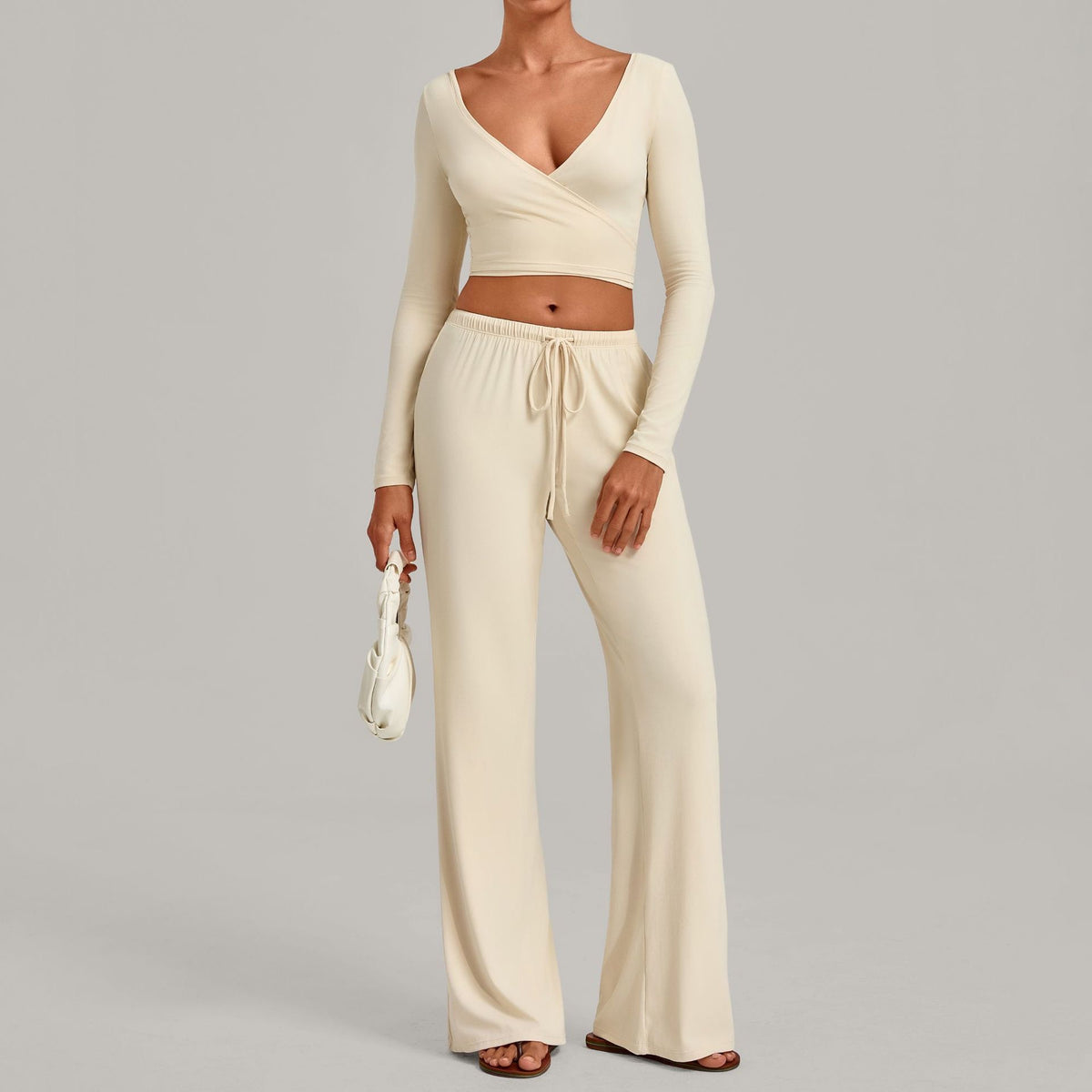 Julia Active Set in Cream — cropped long-sleeve wrap top with matching wide-leg drawstring pants