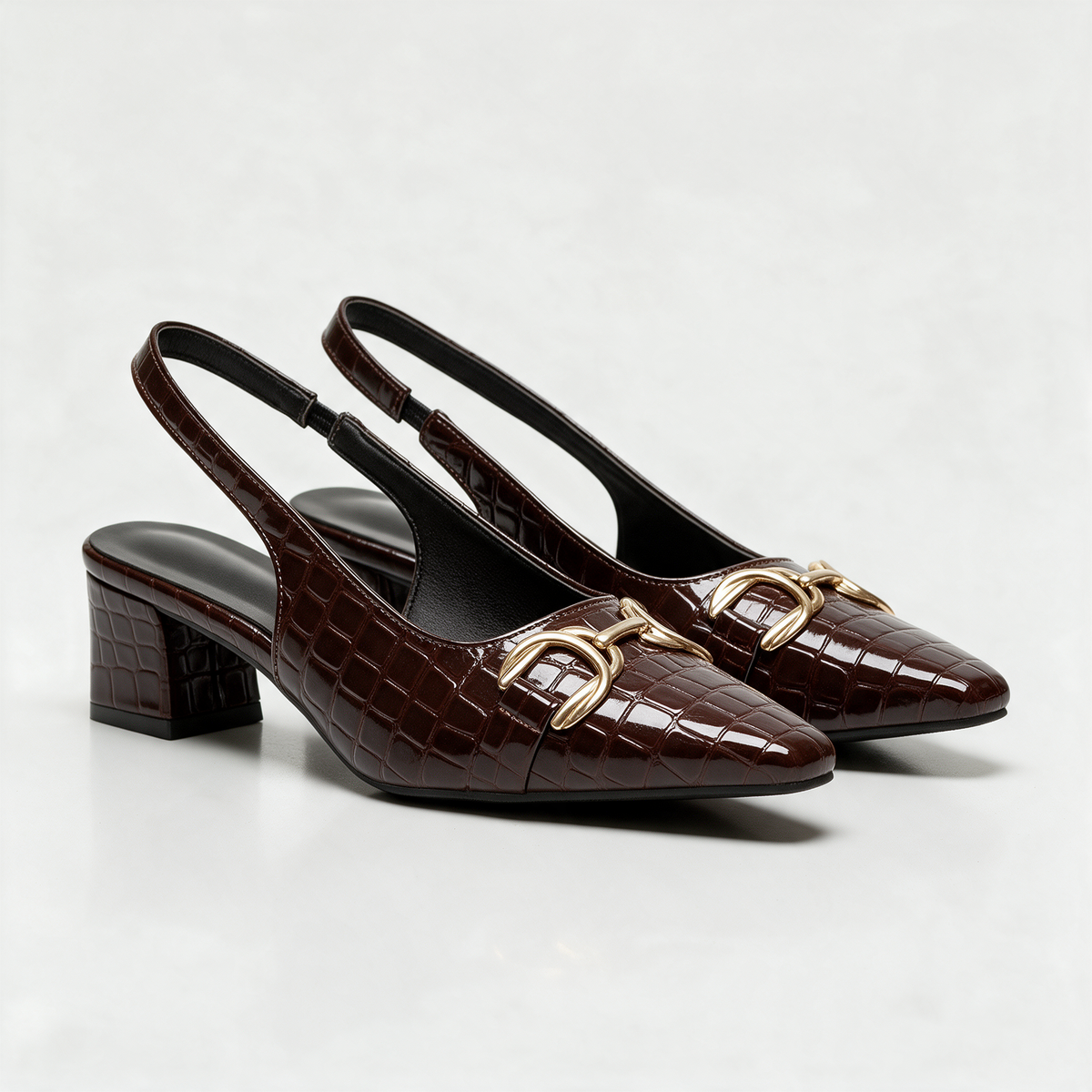 Sophie Croc Slingbacks in Dark Brown — pair showing the gold horsebit buckle and pointed toe