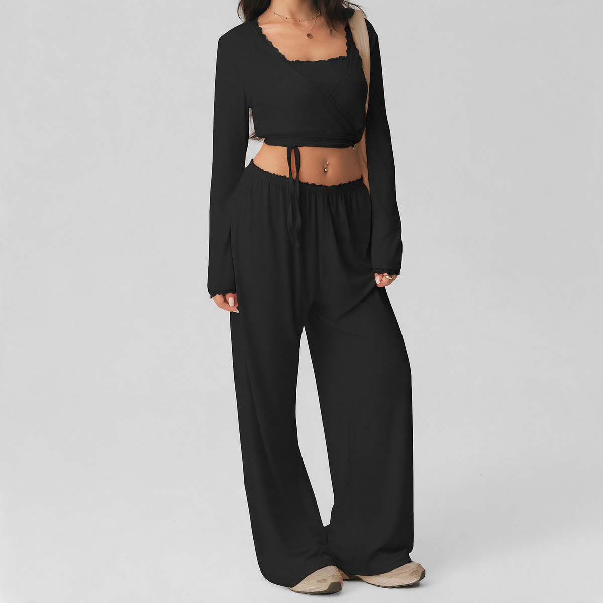 Kate Pajama Set in Black — ribbed knit cami, cropped tie-front shrug, and wide-leg pants worn together