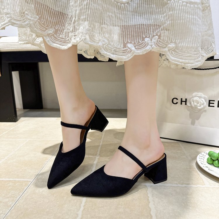 Chloe Pointed Mules in Black — on-foot view showing the block heel height