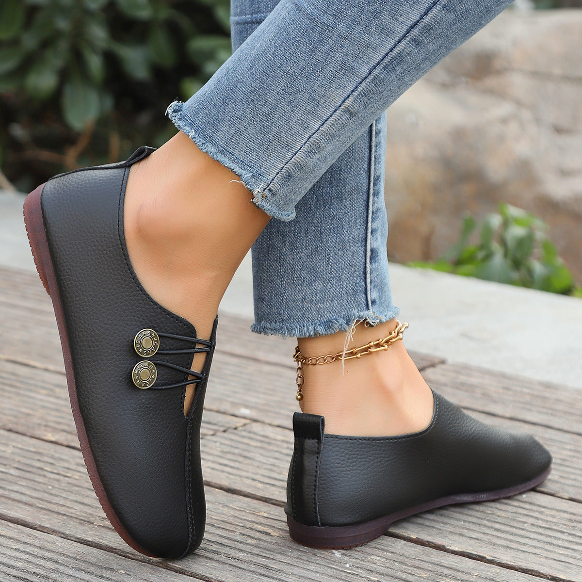 Juliette Slip-On Flats in Black — buttery-soft leather flats with twin-button detail