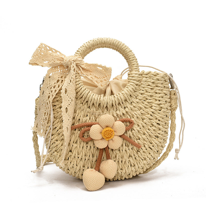 Noemi Straw Bag in Beige — woven straw handbag with lace bow