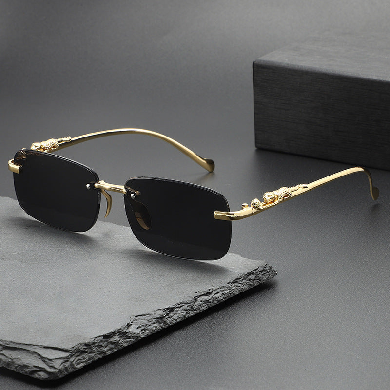 Dante Sunglasses in Black — rimless frame with gold leopard temples