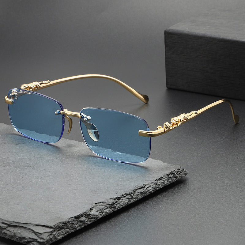Dante Sunglasses in Blue — rimless frame with gold leopard temples