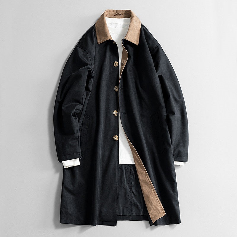 Sutton Trench Coat in Black — knee-length cotton twill trench with tan corduroy collar and slash pockets